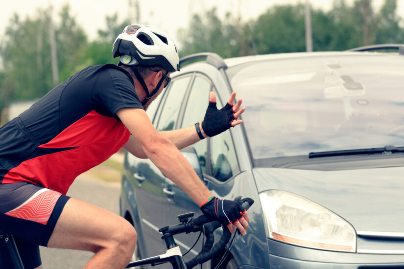 Cyclist Raising Hand For Contact With Light Vehicle